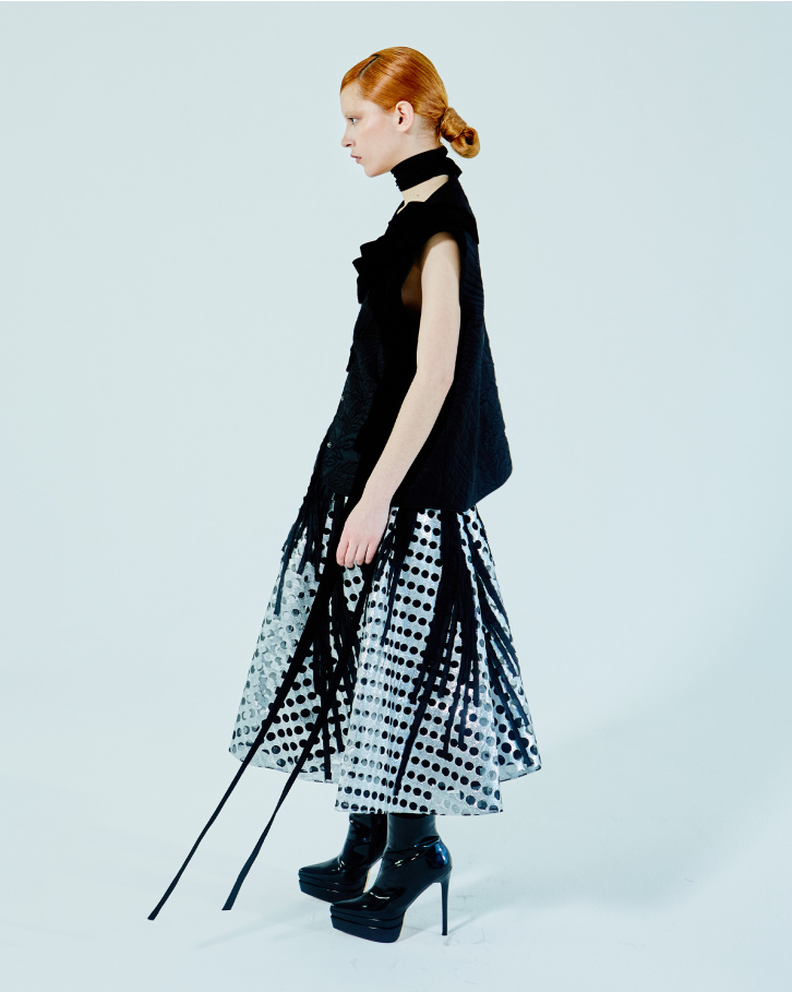 Black zipper jacket and chrome applique skirt