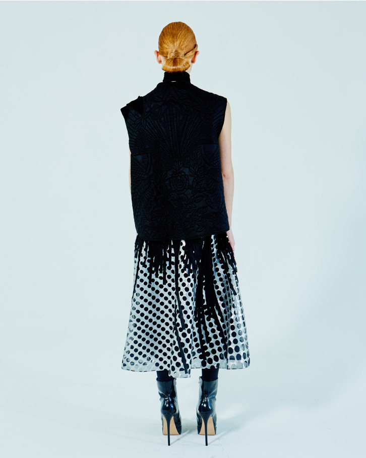 Black zipper jacket and chrome applique skirt