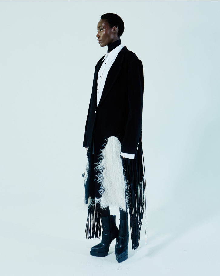 Black single-buttoned trench coat and white shirt