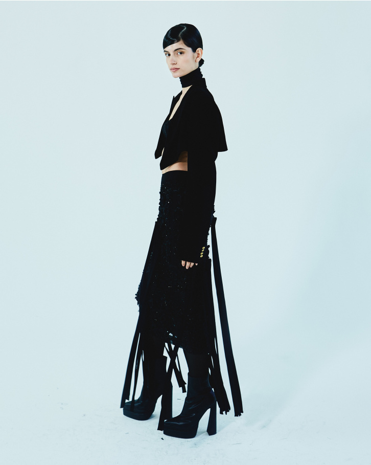 Black fringed skirt with bralette and short jacket