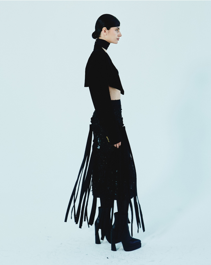 Black fringed skirt with bralette and short jacket