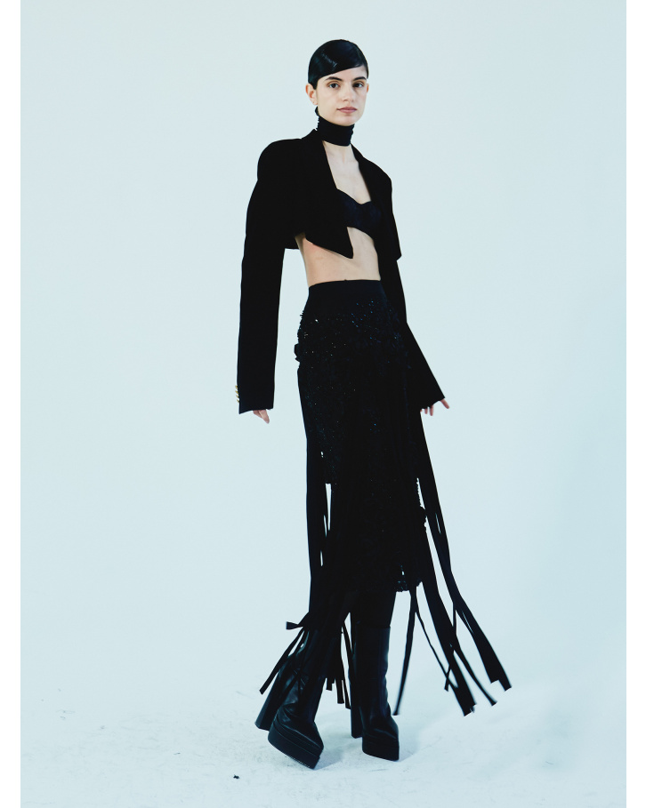 Black fringed skirt with bralette and short jacket