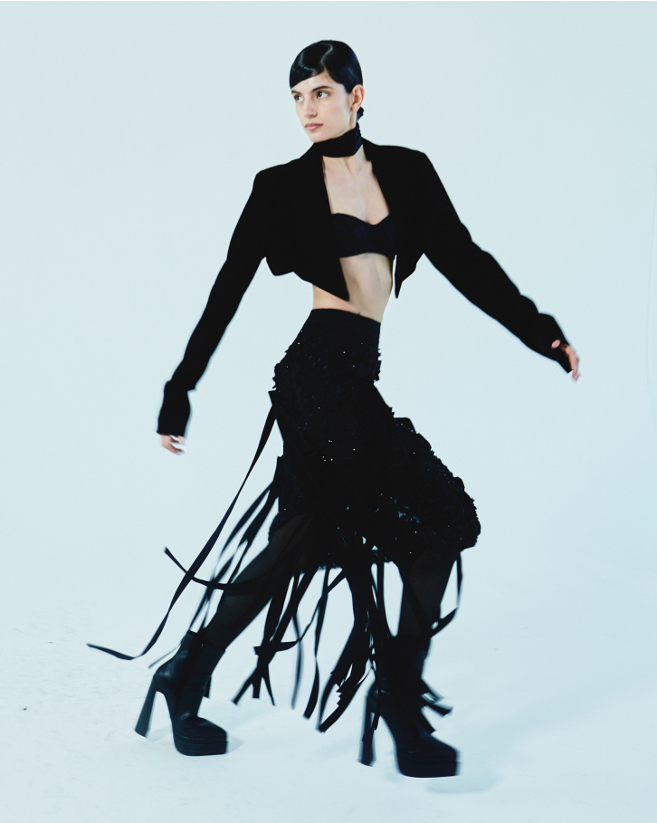 Black fringed skirt with bralette and short jacket