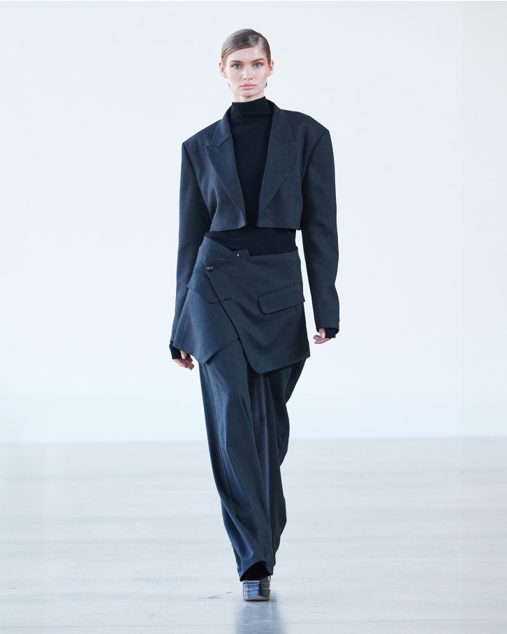 Black turtleneck sweater with grey blazer and pants