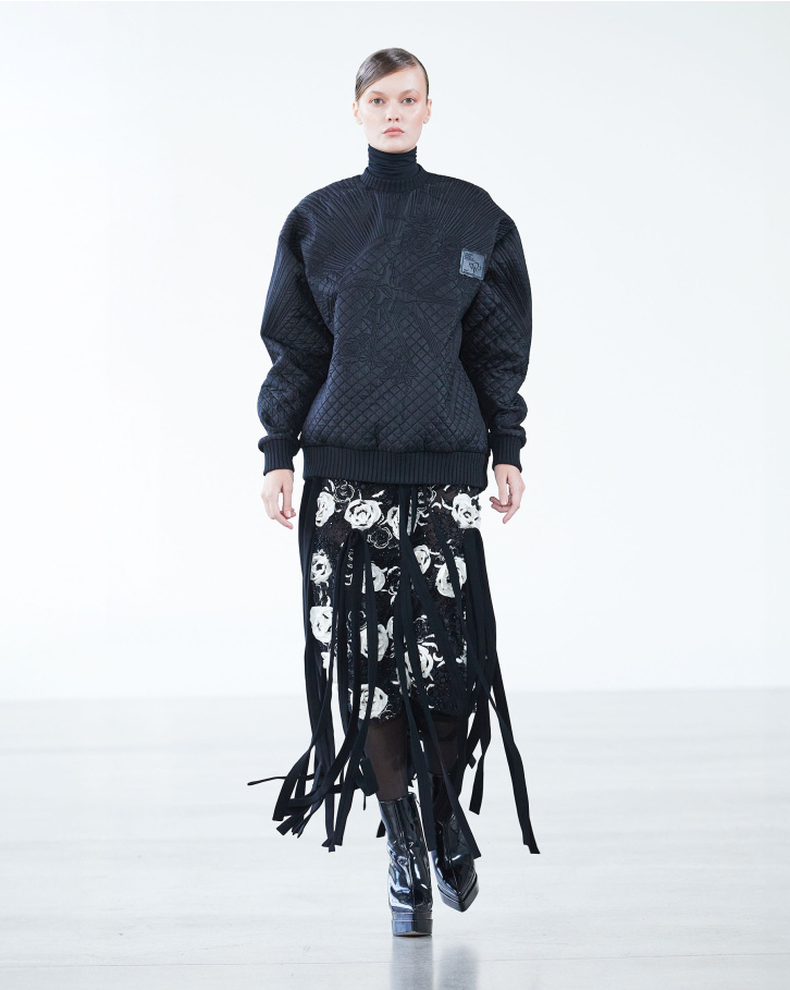 Black sweatshirt and fringed skirt