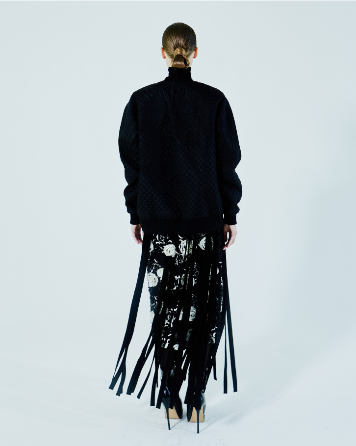 Black sweatshirt and fringed skirt