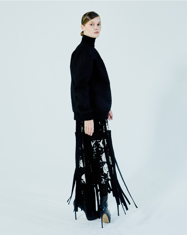 Black sweatshirt and fringed skirt