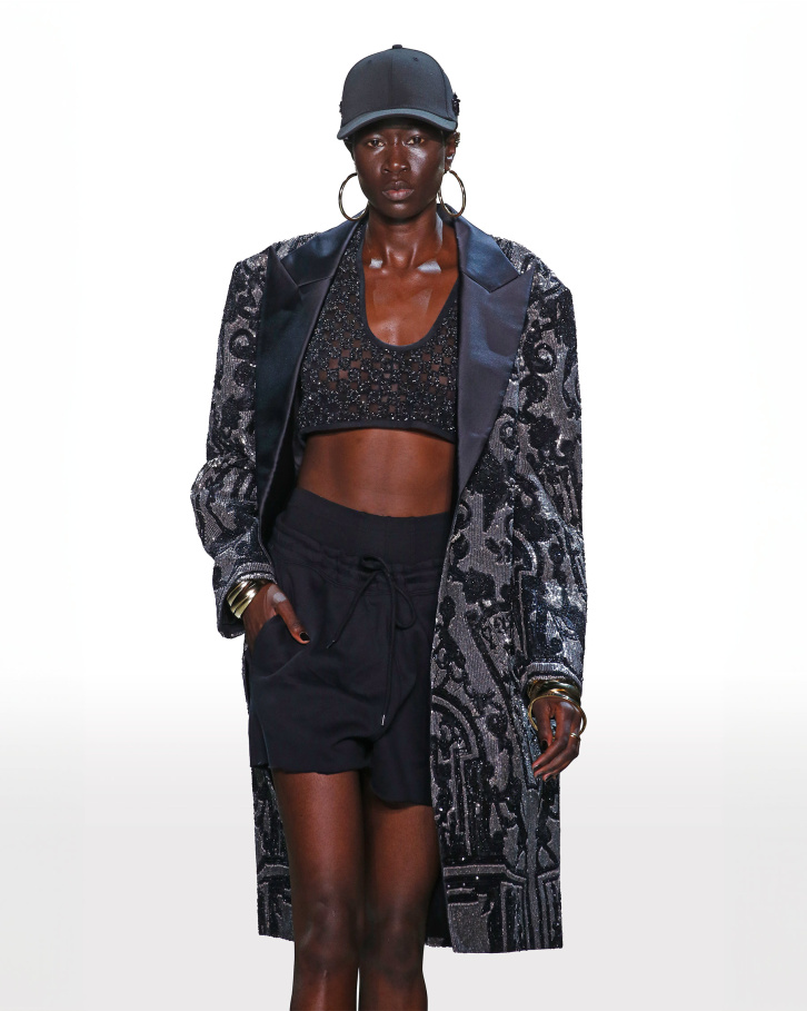 Sheer top and shorts with black trench coat