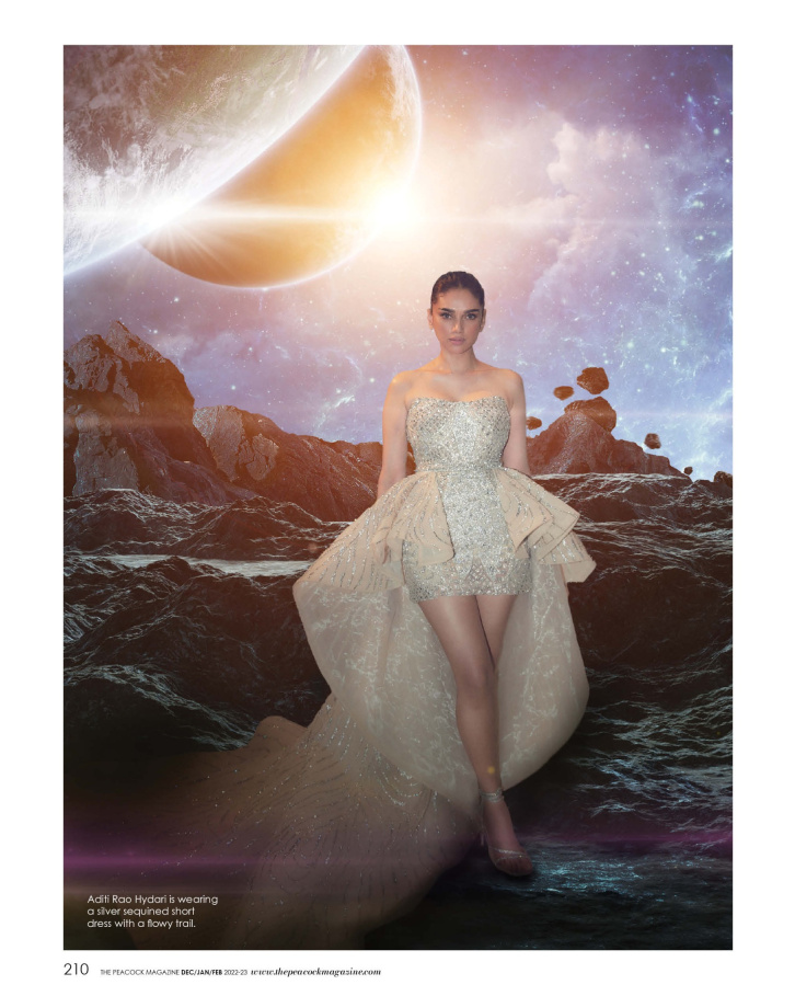 Aditi Rao Hydari is wearing a silver sequined short dress with a flowy trail