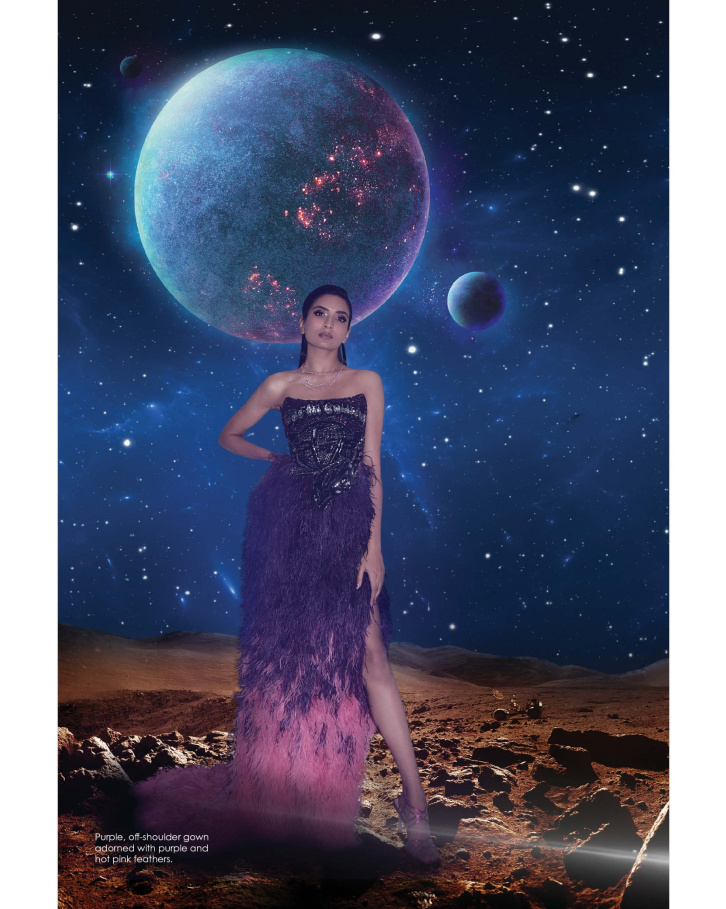 Purple, off-shoulder gown adorned with purple and hot pink feathers