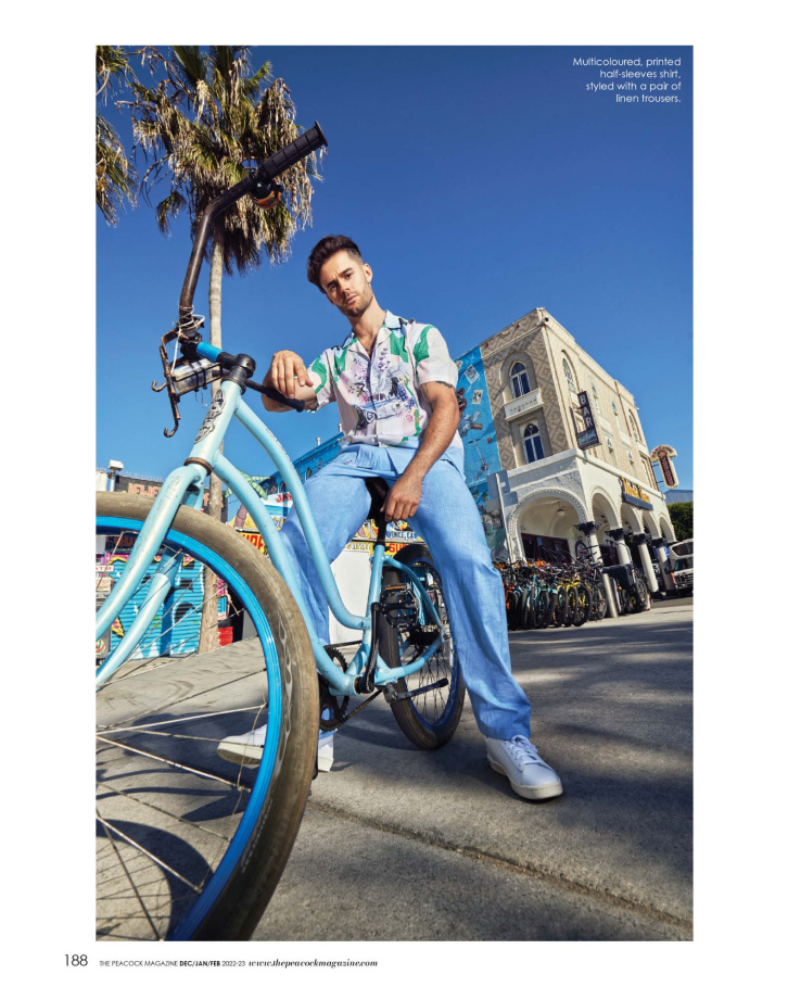 Multicoloured, printed half-sleeves shirt, styled with a pair of linen trousers
