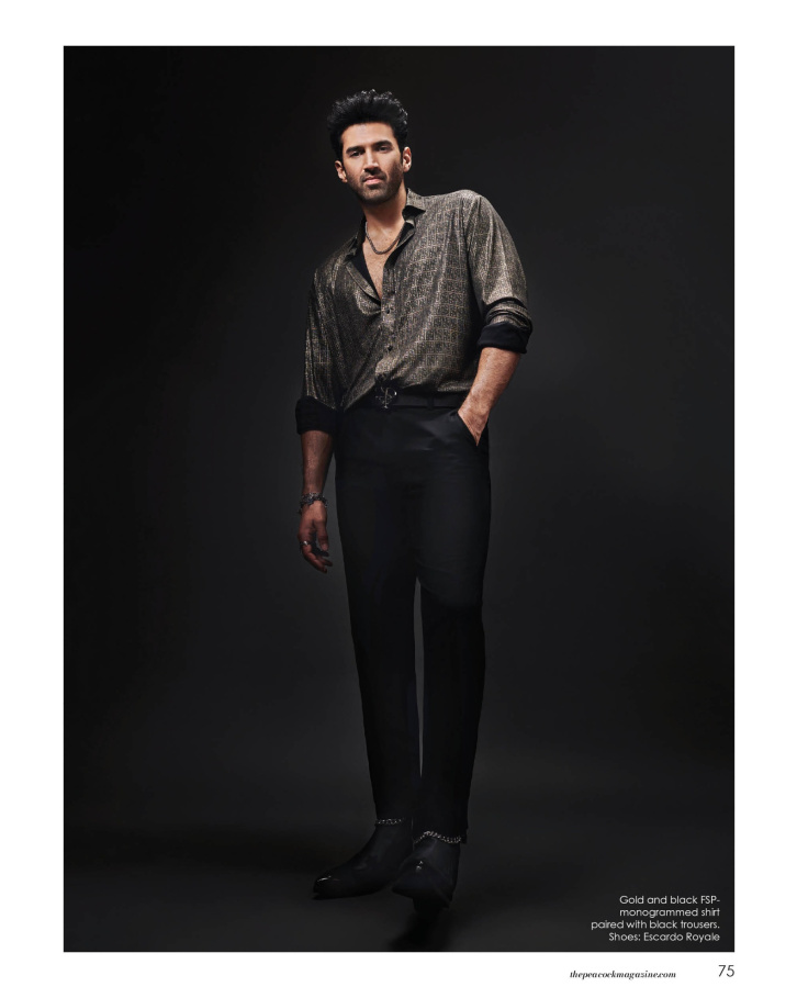 Gold and black FSP monogrammed shirt paired with black trousers