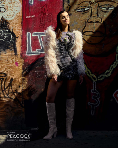 Trailing black and silver embellished short dress and peach feather shrug