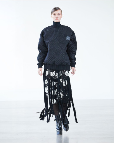 Black sweatshirt and fringed skirt