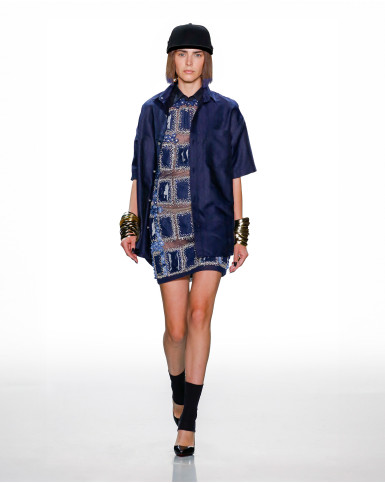 Blue cut-out dress with a monogrammed shirt