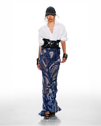 Blue denim appliqué skirt with a white shirt and black belt