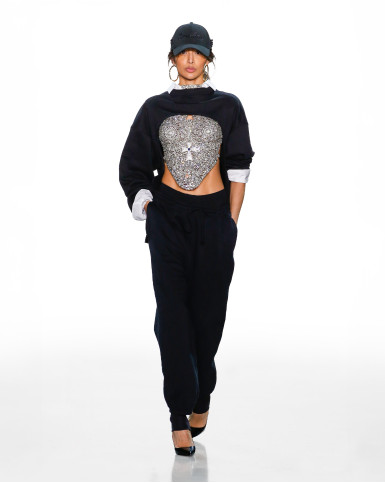 Silver breastplate with black sweatpants and arm warmers