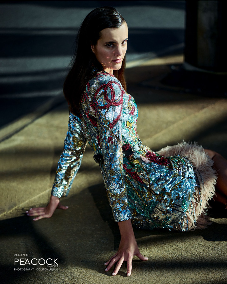 Multicoloured, sequin dress with a feathered hemline