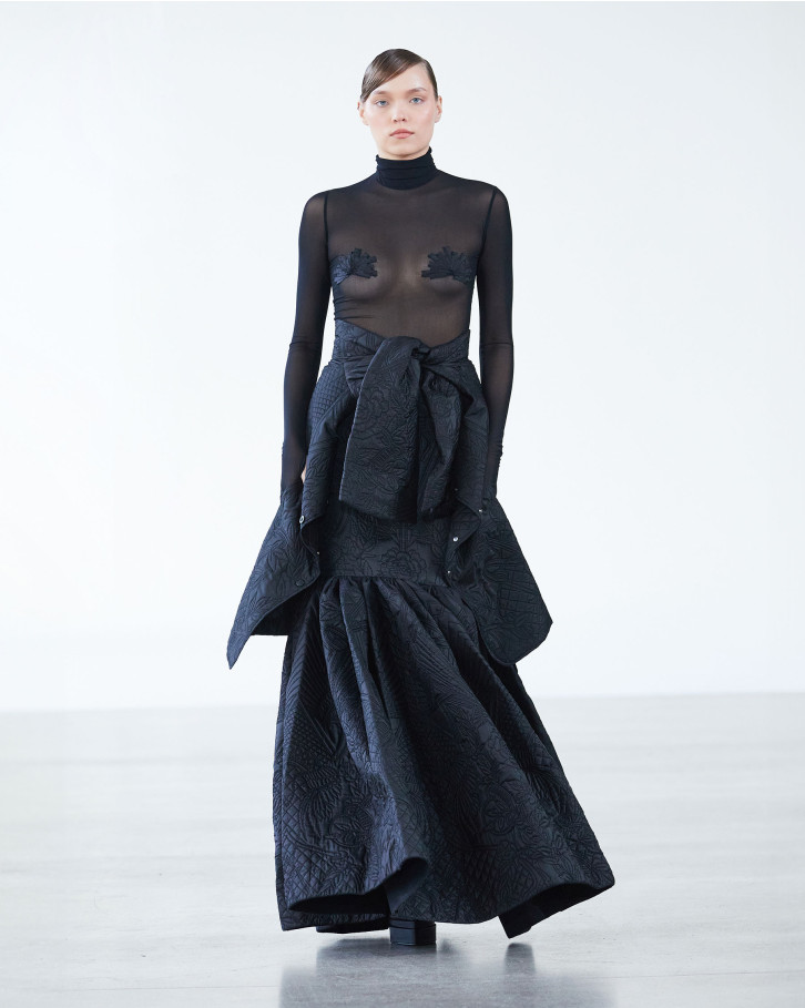 Black turtleneck bodysuit, quilted long skirt and blazer