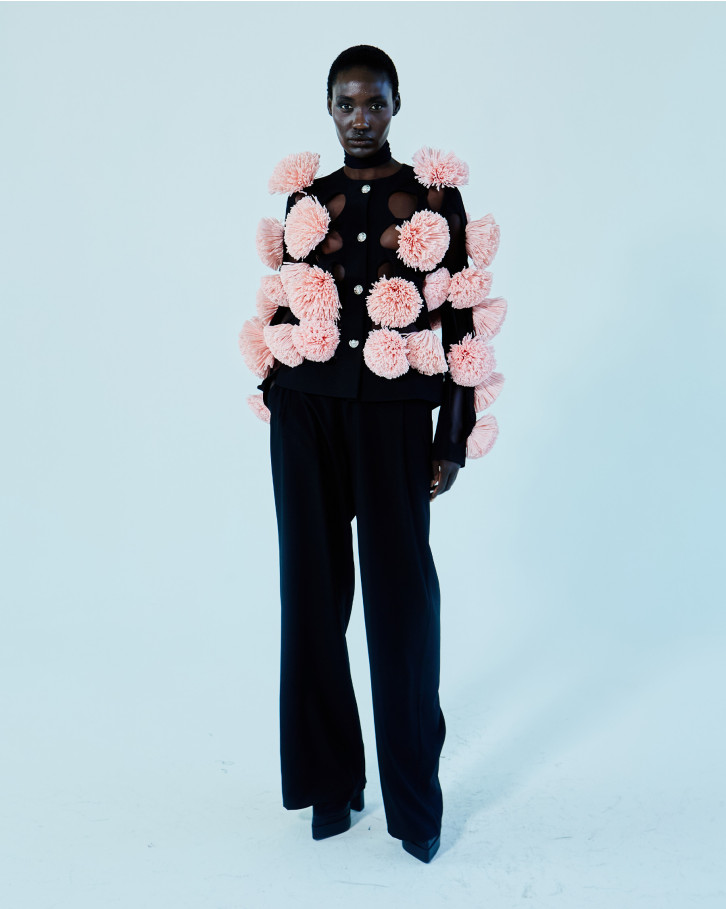 Black jacket with pink flowers and straight pants