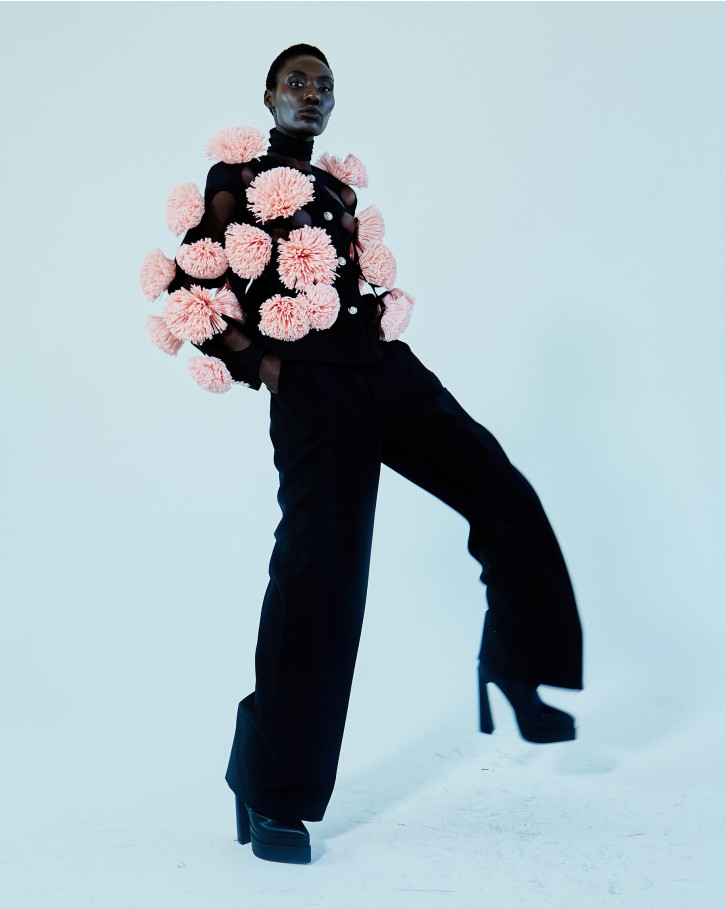 Black jacket with pink flowers and straight pants
