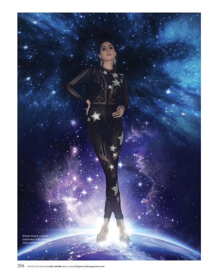 Sheer black catsuit adorned with sequins and astral motifs