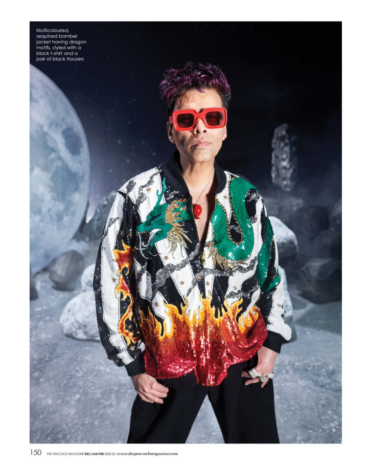 Multicoloured, sequined bomber jacket having dragon motifs, styled with a black t-shirt and a pair of black trousers
